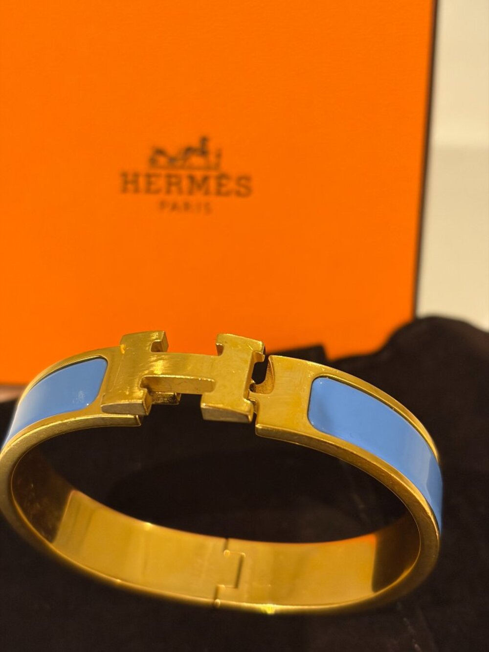 Authentic Hermès Clic Clac H Bracelet in Gold-Plated Hardware with Blue Enamel.